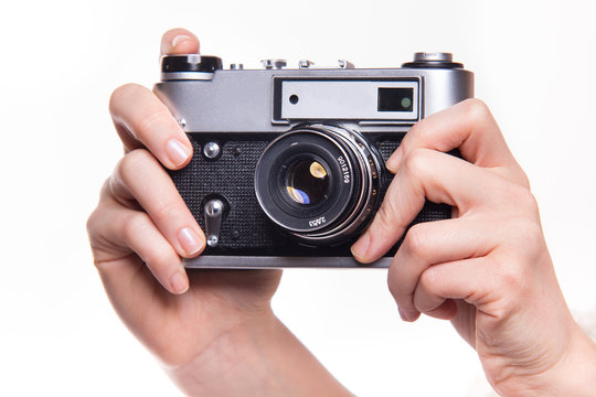 Classic 35mm photo camera in hand