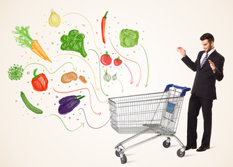 Businessman with shopping cart with vegetables