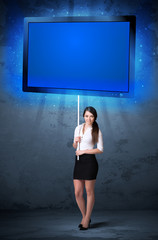 Businesswoman with shining tablet