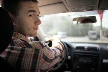 inside the car driver driving on the road