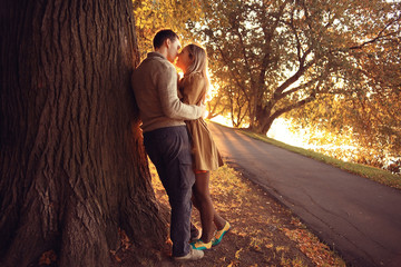 summer evening in love couple in the park sunbeams happiness