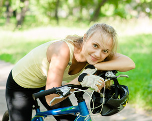 Fototapeta na wymiar Happy woman on mountain bike