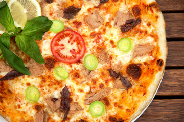 Delicious italian pizza served on wooden table