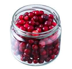 Ripe cowberry in a glass jar