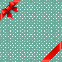 Obraz premium Bow and ribbon on green polka dot background