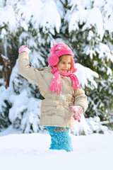 Little child playing in snow