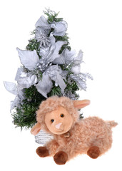 Soft sheep toy near christmas tree