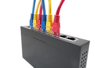 Closeup of network cables connected to router on white