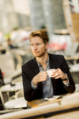 Young businessman in the cafe