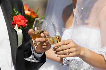 wine glasses in hand bride and groom