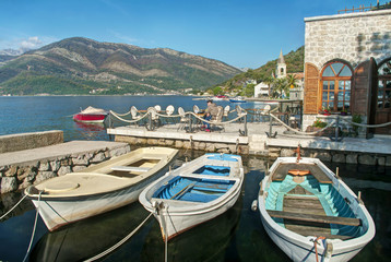 Fototapeta na wymiar three boats near old restaurant