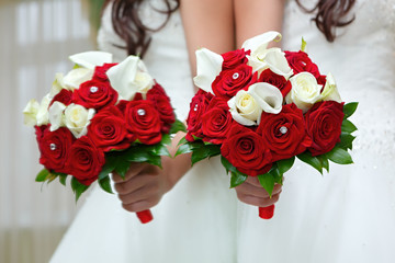 The bride at the wedding is holding a bouquet of flowers