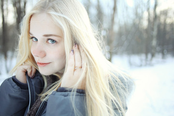 winter portrait of a cute blonde teen