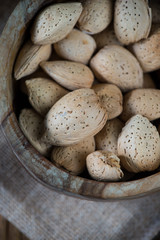 Almonds in wooden bowl