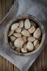 Almonds in wooden bowl