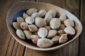 Table top view on almonds in bowl