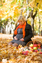 pregnant woman in autumn park