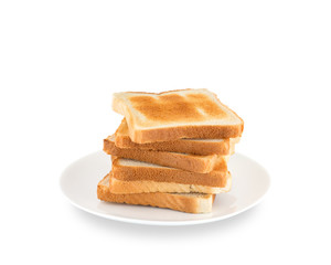 A pile of toasts on a white plate on a white background.
