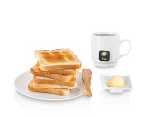 Stack of toasted bread with butter and tea.