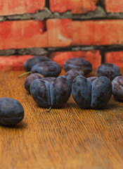 plums on a wooden table