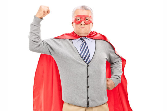 Senior in superhero outfit with his fist in the air