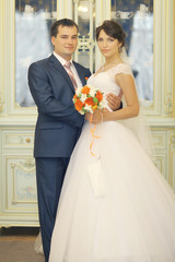 bride and groom portrait in the room