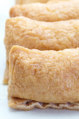 sushi flavored boiled rice wrapped in fried tofu
