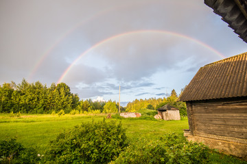 Double rainbow, summer field landscape