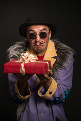 Clown man with Christmas gift box