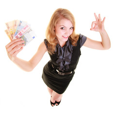 Obraz premium Economy finance. Woman holds euro currency money.