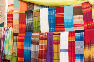 Colorful oriental fabrics in the medina of Essaouira, Morocco