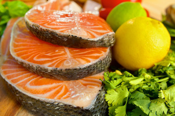 Delicious  portion of fresh salmon fillet with lemon and parsley