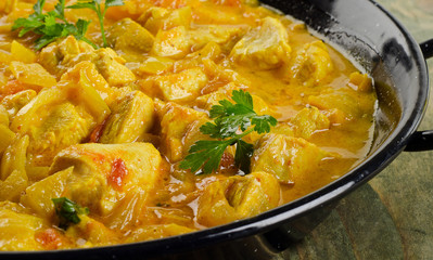 Chicken curry on a wooden background