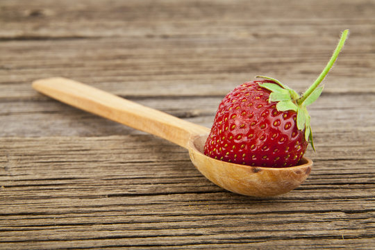 strawberry in a spoon