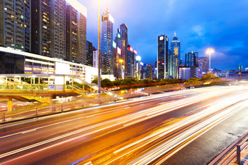 blur motion traffic lights of modern urban city at night