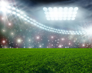 Soccer ball on green stadium arena