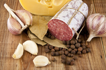 salame, garlic and laurel leaves