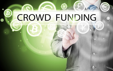 Businessman pushes virtual crowd funding button