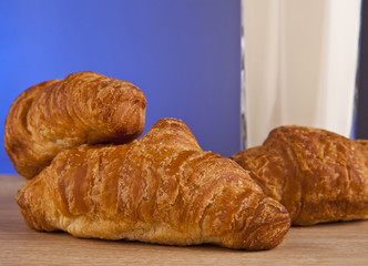 glass of milk with croissants