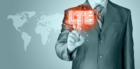businessman is pushing his finger on lte button
