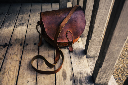 Leather bag on wooden terrace