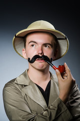 Man in safari hat in hunting concept