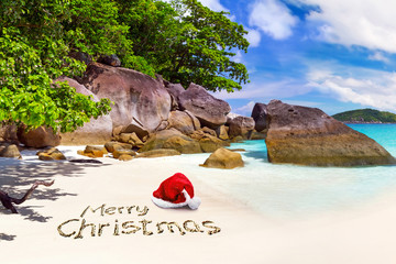 Merry Christmas with santa hat from the tropical beach