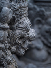 Fototapeta na wymiar Stone sculpture on entrance door of the Temple in Bali
