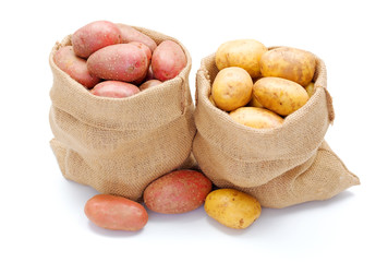 Red and white potatoes in burlap sack