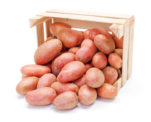 Red potatoes in wooden crate