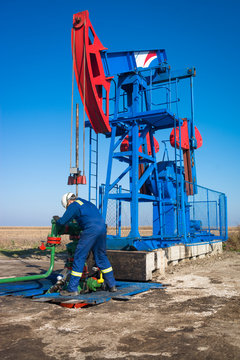 Oil Worker Check Oil Pump