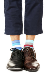 Man leg in suit and colorful socks, isolated on white