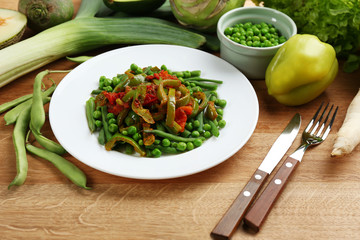 Healthy salad with peas, asparagus and pepper, close-up