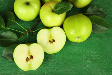 Ripe apples on wooden background